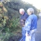 The parental units peer at a bush.