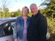 Mum and Dad by the car.