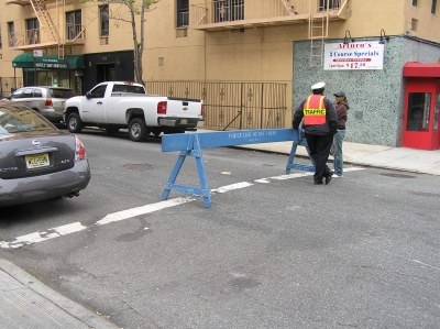 Mysterious barricade and traffic officer, on my chosen corner