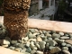 Rocks on grates over pots