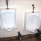 urinals -- lots of writing at eye level urinals -- lots of writing at eye level
