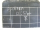 A close up of Daryl's 12:57 inside the general office.