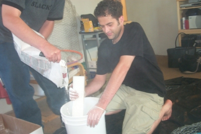 Papa Smurf and Tyrone Tyrone mixing plaster