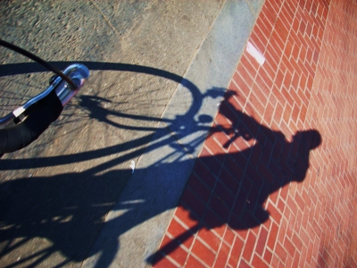 Aviator Cap, Suit Coat, Bullhorn, Bicycle. 