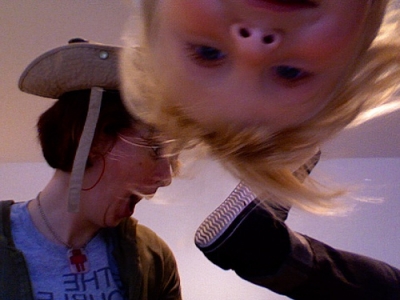 Inky in baby safari hat, shoe kick, and baby