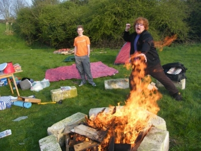 Adam lights the campfire