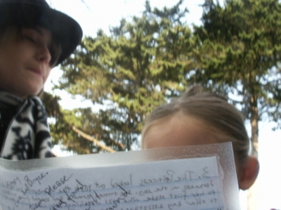 Bryce waits "patiently" while Evie reads.