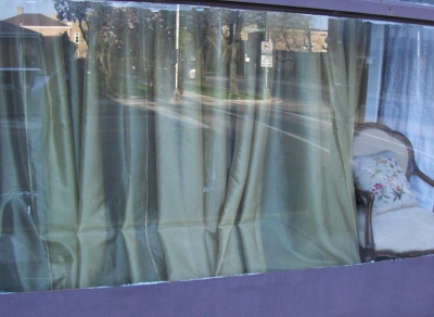 Drapes, in the drapery store! Are they exhibiting or cloaking their wares?