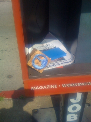 The stamp inside the newspaer stand.