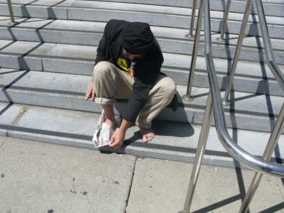 Fitting the origami slippers.