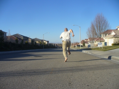 Down the middle of an abandoned street in suburbia.
