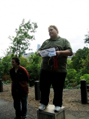 From soapbox high a quiet voice commands.