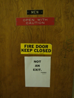 AA bathroom door: inside bathroom...why do they need the "Men" sign inside the bathroom?