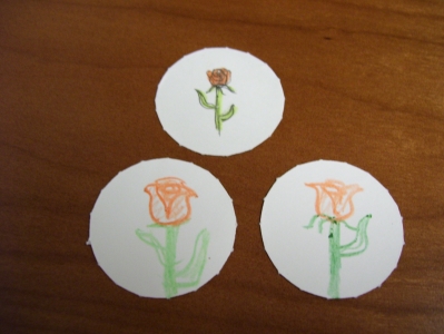 Three orange roses. 