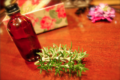 Brown glass and green rosemary.