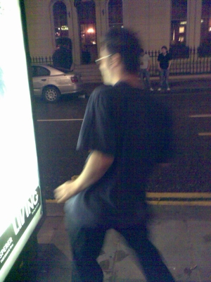 Charlie Fish dancing in the bus stop