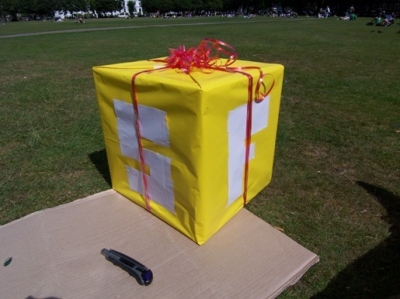 Nothing says present like a big shiny bow thing.