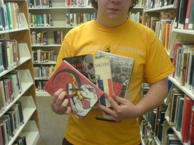 Me holding the books in the library