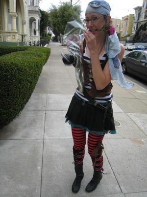 lefthanded pirated removes a flower with her teeth