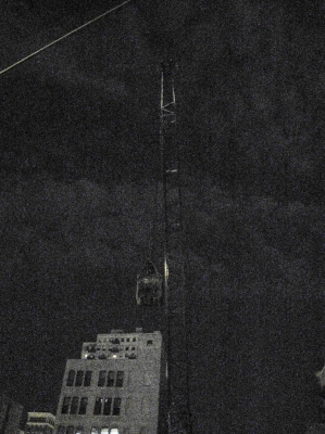 crane against the night sky