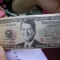 a million dollar bill with Ronald Reagan...