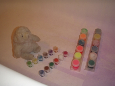 She gathers her paints.