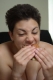 Young Female Homo sapien sapiens eating more