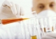 man_transferring_contents_of_test_tube.jpg