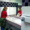 Alice washing her hands at the sink