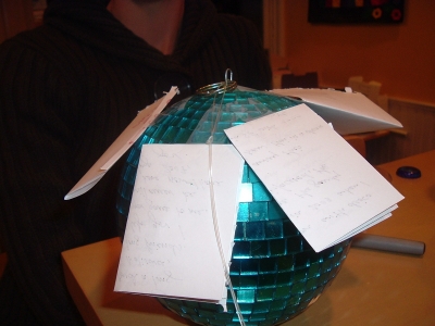 Disco ball with notes attached.JPG