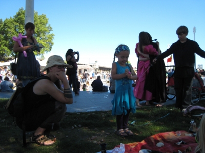 A wee one and her mom looking at the wares A wee one and her mom looking at the wares