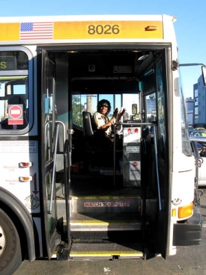 A bus driver dances with us from her bus. A bus driver dances with us from her bus.