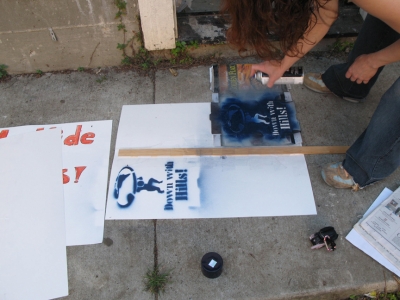 Bex stenciling signs and t-shirts. Bex stenciling signs and t-shirts.