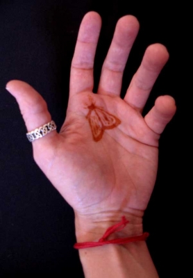 Ring, moth, and thread.