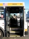 A bus driver dances with us from her bus.