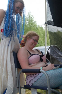 Strangers writing postcards