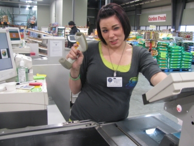 the awesome cashier strikes a pose