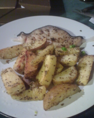 Shark steak served with peas and grilled parsnip and potatoes chunks