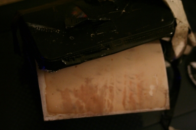 paper negative being pulled out of camera