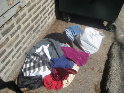 pile of clothes. found a nice knitted scarf.