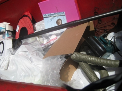 and in here i found a vacuum cleaner and a brand new fold-up cat carrier. 