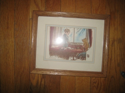 framed picture of winnie the pooh. not sure if i'll keep the picture but the frame is very nice.
