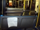 Full shot of bus with note taped to back of seat
