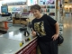 Amby shows off our fancy foam brushes and waits for the paint to mix