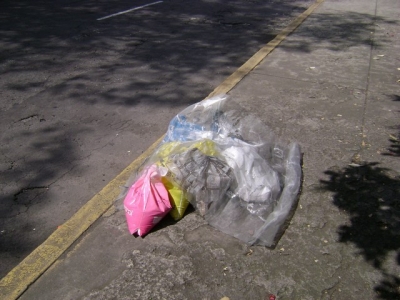 Dropped sandbags, on the sidewalk across the installation spot. Dropped sandbags, on the sidewalk across the installation spot.