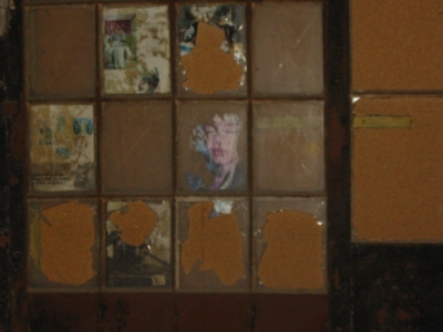 Boarded-up window.