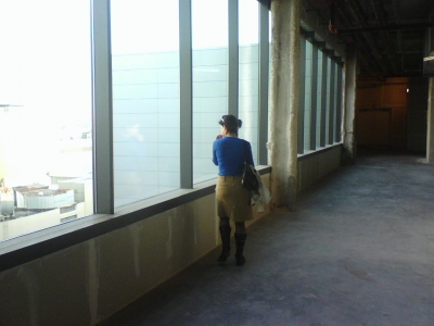 Jackie gazes out the office window