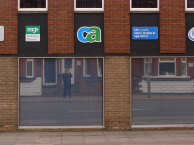 Myself in the window of a building. 