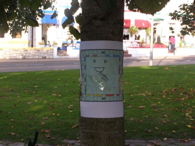 The board, stuck to a tree