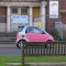 A pink SMART car